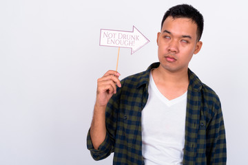 Canvas Print - Portrait of stressed young Asian man with paper sign