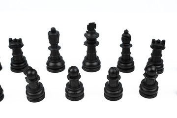 Eight different black color pawns placed on top of a white isolated background