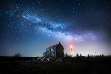 Abandoned house under Milky Way