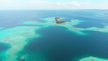 Wall Mural - Aerial: flying over exotic tropical island secluded destination away from it all, coral reef caribbean sea turquoise water white sand beach. Indonesia Sumatra Banyak islands.