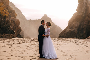 Wall Mural - profile of newlyweds embraced each other against the backdrop of