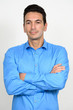 © Ranta Images - Portrait of mature handsome businessman with arms crossed