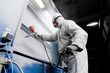 © Sergey - man paints metal with a spray gun