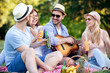 © ivanko80 - Happy friends on picnic in park