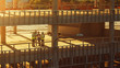 © Gorodenkoff - Aerial View: Diverse Team of Specialists Inspect Commercial, Industrial Building / Skyscraper Formwork Construction Site. Real Estate Project Lead by Civil Engineer, Investor, Architect and Worker