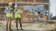 © Gorodenkoff - Two Specialists Using Drone on a Construction Site. Architectural Engineer and Safety Engineering Inspector Fly Drone on Commercial Building Construction Site Technical Control of Design and Quality
