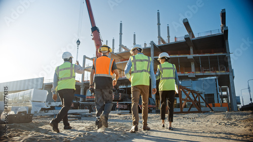 Fotomural Diverse Team of Specialists Inspect Commercial, Industrial Building Construction Site