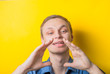 © aeroking - Young funny man shouting with the hand on his mouth