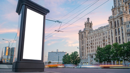 Wall Mural - mock up image - blank vertical street white billboard poster or advertising pillar and fast moving c