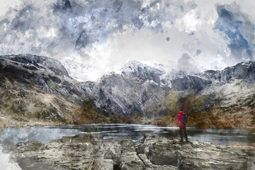 Digital watercolor painting of Beautiful moody Winter landscape image of Llyn Idwal and snowcapped Glyders Mountain Range in Snowdonia