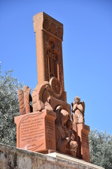 Wall Mural - statue with cross next to the Tomb of Mary Magdalene in Jerusalem.