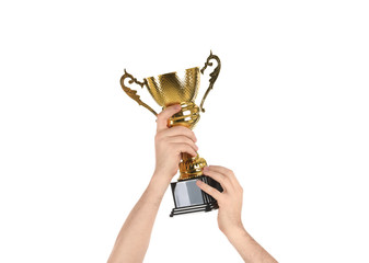 Man holding gold trophy cup on white background, closeup