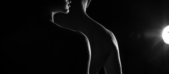 silhouette of a couple. Sexy photo. Sexual. Sexy man and woman. Erotica. 