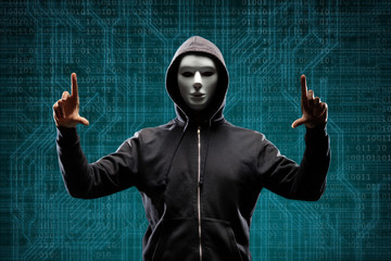 Wall Mural - Dangerous hacker over abstract digital background with binary code. Obscured dark face in mask and hood. Data thief, internet attack, darknet fraud, virtual reality and cyber security.