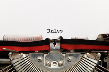 Poster - Rules title text written on paper with typewriter