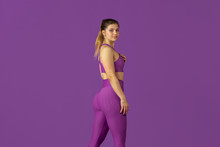 Grace. Beautiful Young Female Athlete Practicing In Studio, Monochrome Purple Portrait. Sportive Caucasian Fit Model Posing Confident. Body Building, Healthy Lifestyle, Beauty And Action Concept.