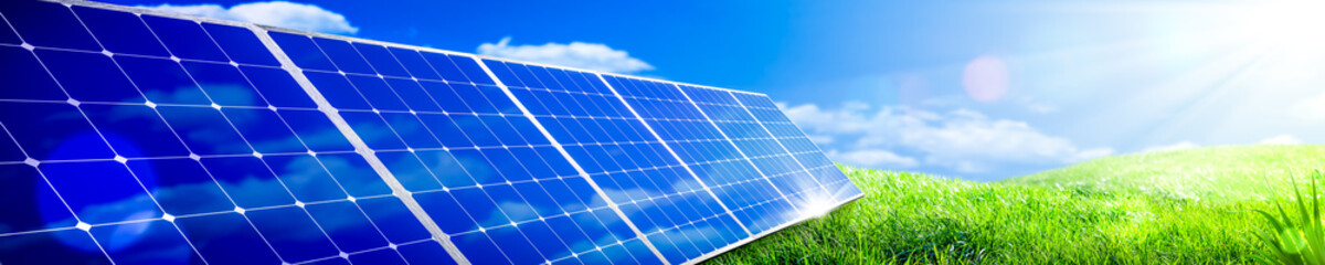 Banner Of Solar Panels In Green Grass Landscape With Blue Sky And Sunlight - Clean Energy Concept