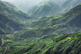 Fototapeta Góry - misty mountain range covered with white mist