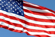 Close-up Of American Flag Against Sky