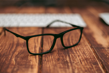 Sticker - Glasses for sight and vision correction and protection from computer on the wooden table