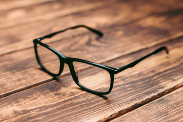 Glasses for sight and vision correction and protection from computer on the wooden table