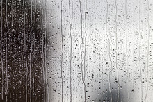 Close-up Of Water Drops On Glass Window