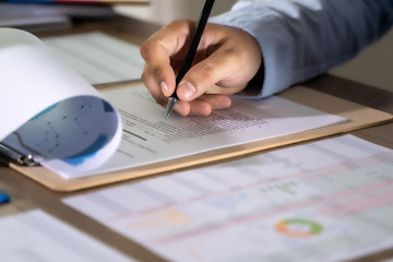Wall Mural - businessman working using a calculator finance accounting concept achievement to balance man assistant accounting.
