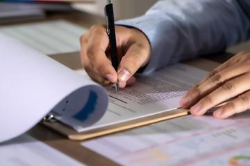 Wall Mural - businessman working using a calculator finance accounting concept achievement to balance man assistant accounting.