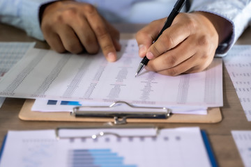 Wall Mural - businessman working using a calculator finance accounting concept achievement to balance man assistant accounting.