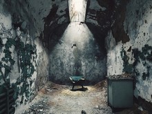 Interior Of Weathered Cell In Abandoned Prison