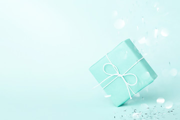 Wall Mural - Turquoise gift box with sparkles.