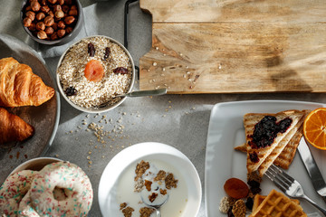 Wall Mural - Breakfast on a table in the sunshine on a beautiful holiday day