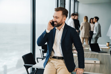 Wall Mural - Attractive young confident businessman in formal wear