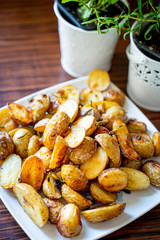 Wall Mural - Baked Potato with Onion, Garlic, Rosemary, Salt and Pepper for Summer Barbeque Party