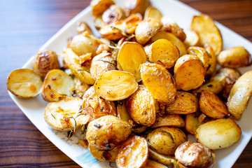 Wall Mural - Baked Potato with Onion, Garlic, Rosemary, Salt and Pepper for Summer Barbeque Party