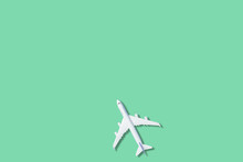 Model Plane,airplane On Green Color Background. 3d Rendering