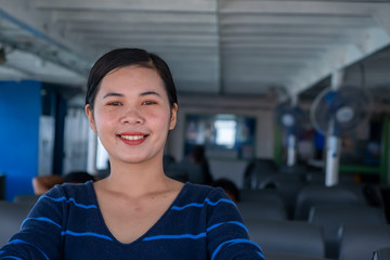 Wall Mural - Close up portrait Happy thai woman enjoying the sea from ferry. summer, holidays, vacation, travel and active lifestyle concept