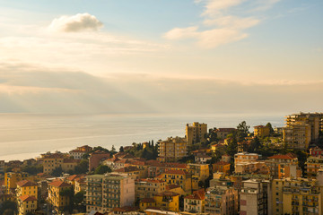 Wall Mural - Elevated, scenic view of the coastal city of Sanremo with a cloudy sky over the sea in the background, Liguria, Italy