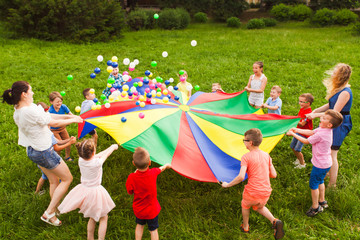 Canvas Print - Birthday games on fresh air with parachute and balls