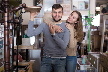 Wall Mural - Couple in antique furnishings store