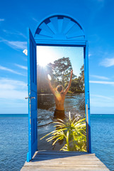 Wall Mural - A blue door on the island of Roatan and on the other side a young woman on the Yojoa river. Honduras