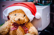 Close-up Of Teddy Bear With Santa Hat At Home