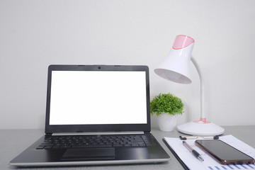 Cropped shot view of  white office desk table with the office equipments, alcohol sanitizer, face mask and other office supplies on the modern space, flat lay.work at home.