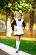 © Andrey_Arkusha - Portrait of a beautiful young first-grader in a festive school uniform