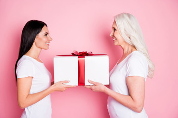 profile photo of pretty old mother young daughter two ladies giving each other large gift box presen