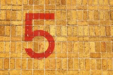 High Angle View Of Red Number 5 On Walkway