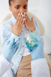 © LIGHTFIELD STUDIOS - selective focus of dentist in latex gloves holding teeth model and dental instrument near shocked african american woman