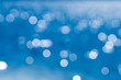 © Pongvit - Bokeh of Blue water reflection With daylight during the day.soft focus.