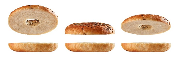 Wall Mural - Halved bagels flying on white background