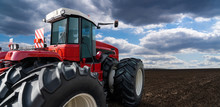Back View Of Tractor On A Agricultural Field